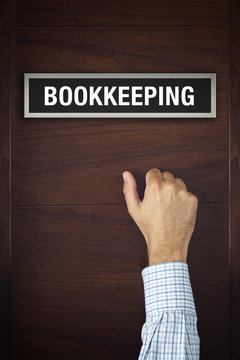 Businessman Knocking On Bookkeeping Office Door