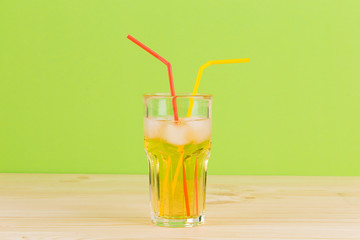Apple juice on wooden table.