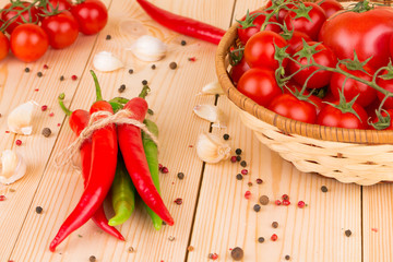 Hot chili pepper on wooden texture.