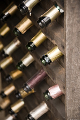 Wooden wine rack with empty bottles