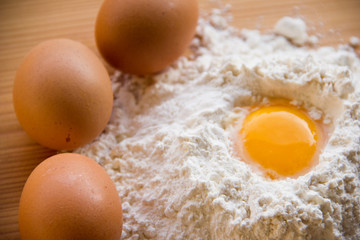 white flour and eggs on the table