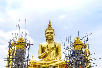 big  golden buddha statue under construction  in thai  temple