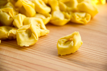 Closeup of uncooked tortellini on the table