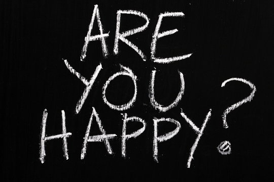 The question Are You Happy? written on a blackboard