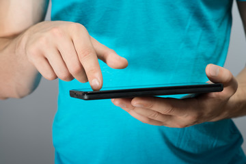 close up hands multitasking man using tablet