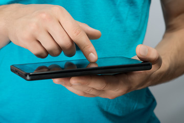 close up hands multitasking man using tablet