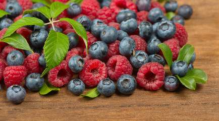 assorted berries on wooden background