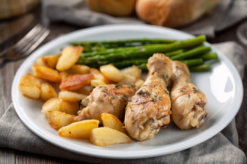 Roast chicken with potatoes and asparagus