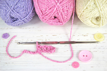 Pretty Crochet scene with yarn wool and buttons