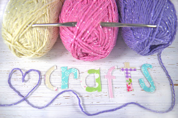 Crafts background with yarn, heart and the word 'crafts'