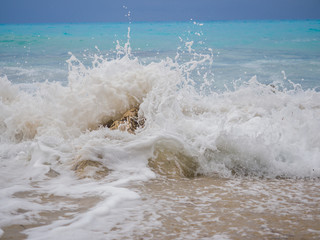 waves breaking on a stony beach