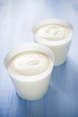 Obraz na płótnie Canvas Homemade yogurt on blue background