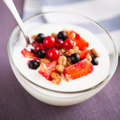 Yogurt with cereals and berries (healthy breakfast)