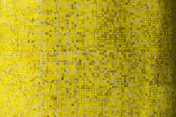 An old yellow crack ceramic tiles wall