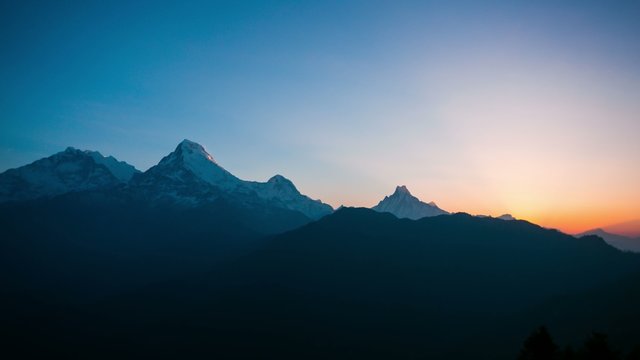 4k timelapse of sunrise at Himalaya mountains. Annapurna I, Annapurna South and Machapuchare mountain (Fishtail) within eyeshot. Poon hill, Ghorepani, Nepal. 