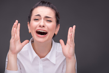 Serious woman wearing white blouse