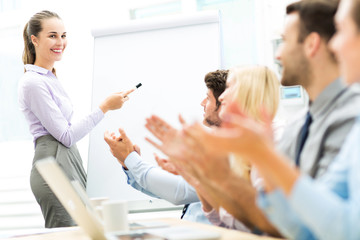 Obraz premium Business people at a presentation, clapping