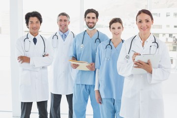 Smiling doctors all standing together