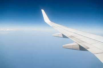 Airplane is flying through the sky without any clouds
