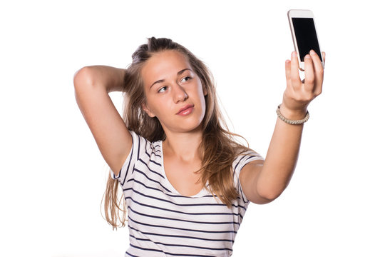 Pretty young girl making self-portrait with her phone