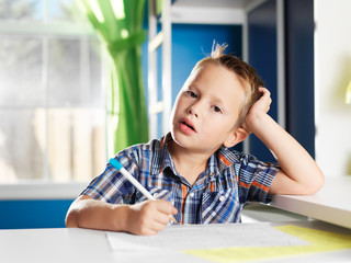 little boy bored with homework