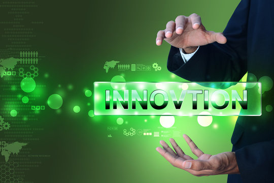 Man hand showing the word innovation