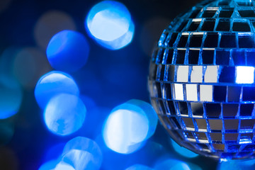 Beautiful disco ball on dark bokeh background