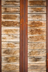 Wooden planks surface with rusty metal bands background