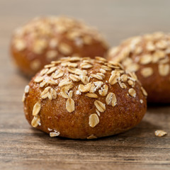 Whole grain wheat dinner rolls. Selective focus.