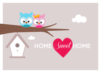 home sweet home, a couple of owls near cozy nest