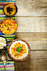 rice with curry chickpeas with vegetables and Arabic flat bread