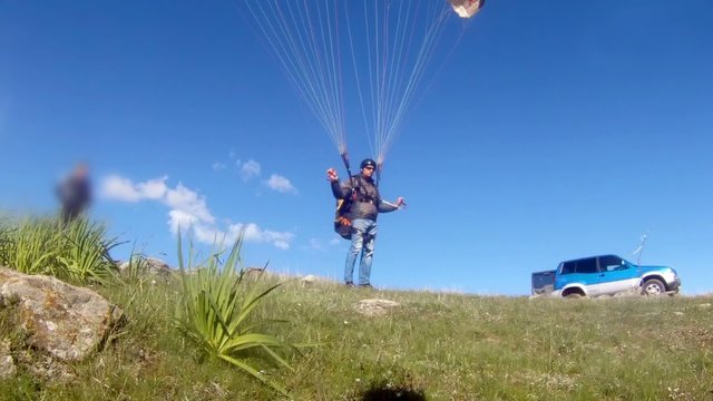 Paraglider launching from the ridge