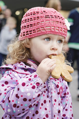 Sweet little girl eating gingerbread © allari