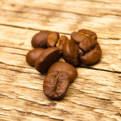 Coffee beans on old wooden table - 1 to 1 ratio