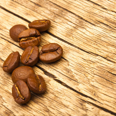 Roasted coffee beans on old table - 1 to 1 ratio