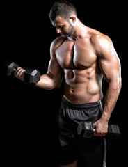 Fototapeta na wymiar Man doing biceps curls in gym.