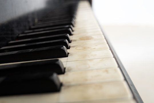 Low angle view of an old piano keyboard