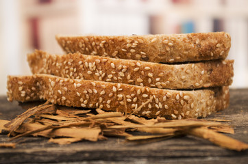slices of whole bread on wooden table