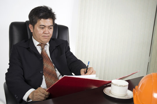 Businessman writing the document