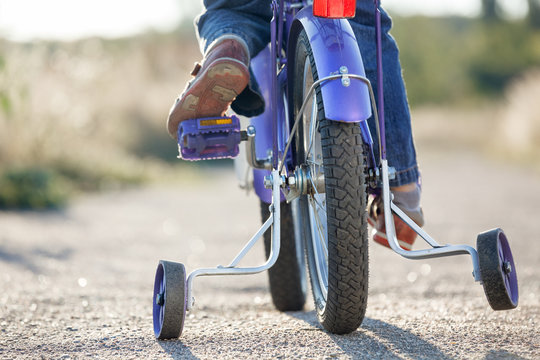Fototapeta Kids bike with training wheels closeup