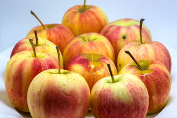Red apples on white background