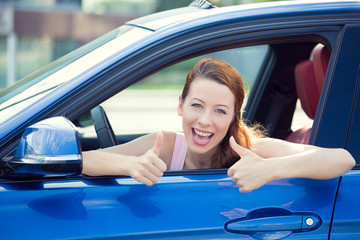 Woman driver happy smiling showing thumbs up