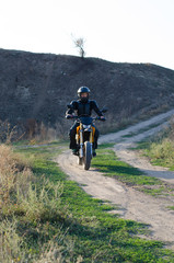 Naklejka premium Rider on sport bike for enduro on motocross track