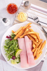 ham, french fries and salad