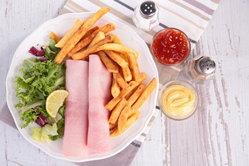 ham, french fries and salad