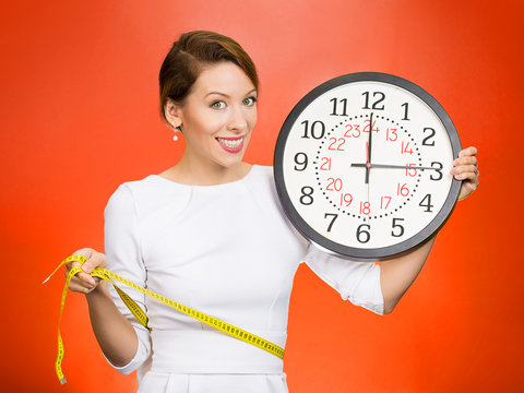 On time great fitness result. Happy woman on red background 