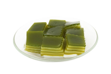 Thai sweetmeat layer pudding mixed with pandanus juice on plate
