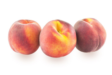 Three peaches on a white background