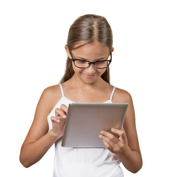 Girl using pad computer playing game on white background