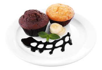 Chocolate and banana muffins on plate isolated on white
